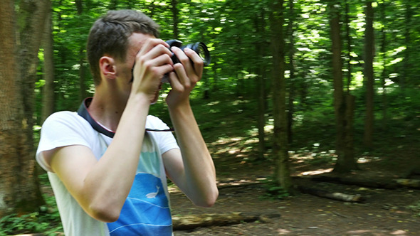 Teen In Wilderness Area Taking Picture alt