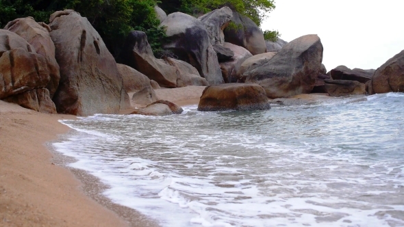 Dramatic Rocky Shore Full Of Sea Foam On The