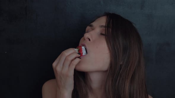 Sexy Young Girl With Red Lipstick Eating Strawberries