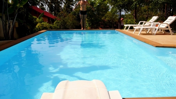 Tanned Man Diving In Private Swimming Pool