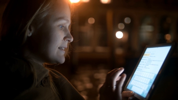 Woman Chatting On Pad During Boating In Venice alt