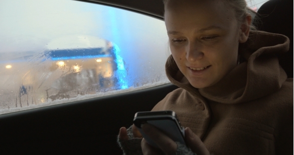 Woman Using Smartphone In The Car alt