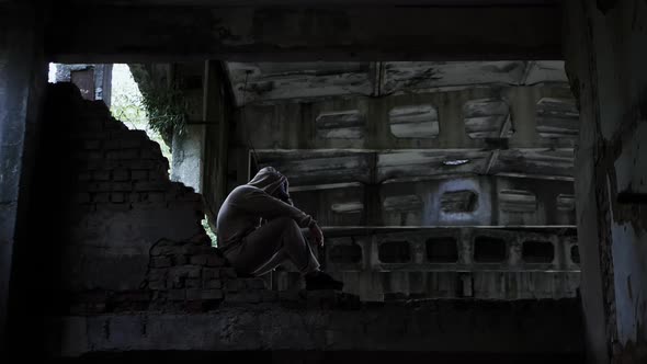 Social Problems In People. A Sad Man In An Abandoned Building, A Depressed Man