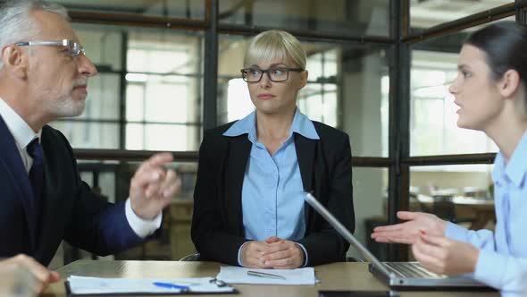 Young Employee Displeased With Colleagues Argument, Toxic Work Environment