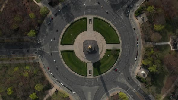 AERIAL: Overhead Birds Eye Drone View Rising Over Berlin Victory Column Roundabout with Little Car