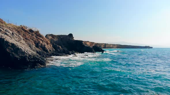 High Cliffs and Sea Beating on Them