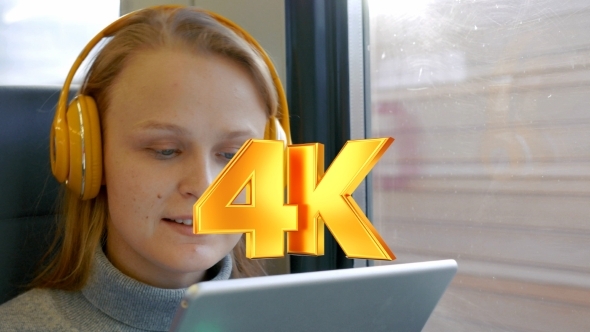 Woman In Headphones Listening To Music On The Way alt