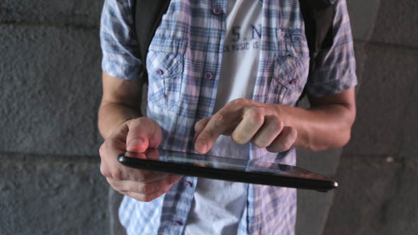 Man with the Tablet in City