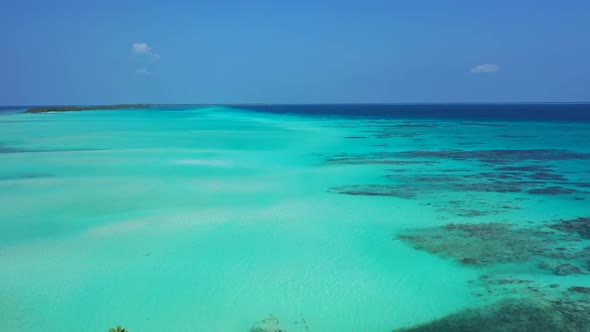 Aerial drone travel of marine coast beach trip by blue ocean with white sand background of a dayout 