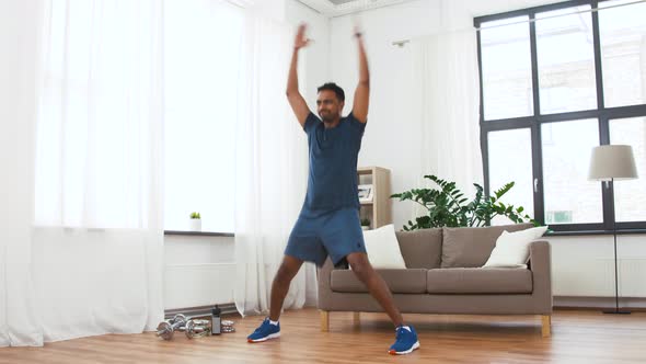 Indian Man Doing Jumping Jack Exercise at Home