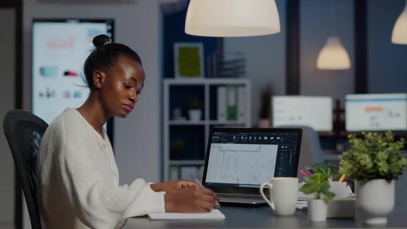 African Architect Analysing Digital Plans From Laptop