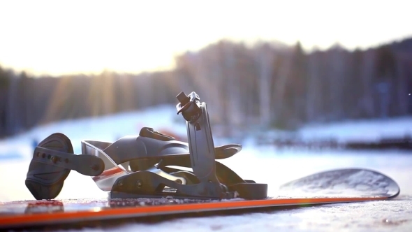 Snowboard Against a Blurred Background Mountains