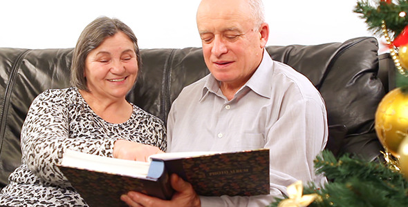 Senior Couple with Photo Album on Christmas 3