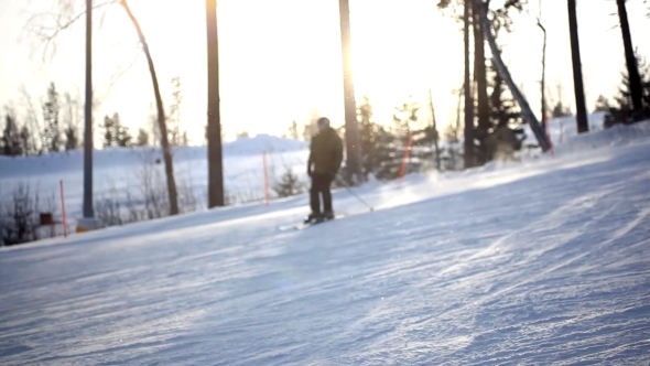 Free-rider Blurred Skier Moving Down In Snow