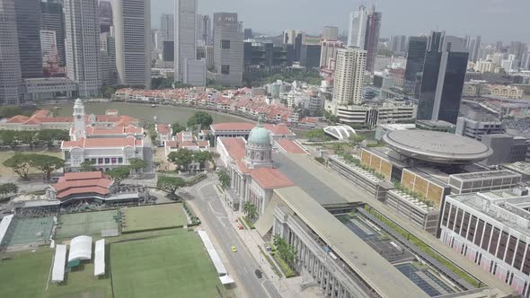 Aerial view of Singapore Marina Bay Sands mall with canal, road, cars. Modern skyscrapers in city