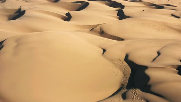  Aerial Drone View Flying By Beautiful Wavy Sand Dunes in Golden Sunset Light