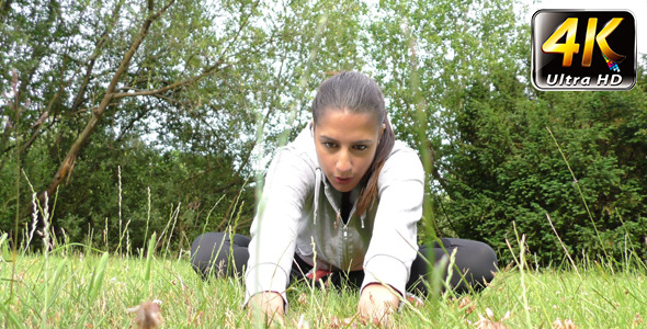Young Woman Training on Grass in Nature 2