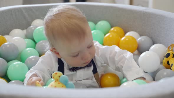 Kid Playing in Ball Pit at Home