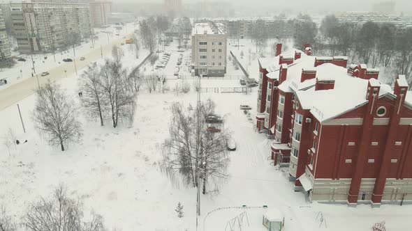 Modern Apartment Buildings Covered with Snow After a Blizzard