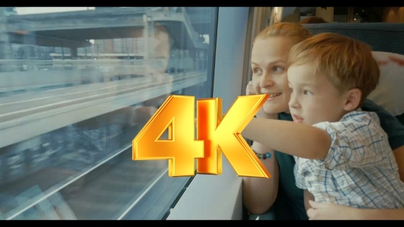 Mother And Son Traveling Across The City By Train alt