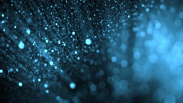 Super Slow Motion Shot of Blue Glittering Atmospheric Particle Background on Black at 1000 Fps