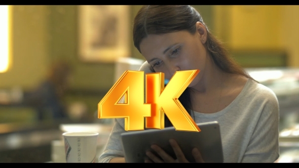 Evening With Phone And Tablet PC In Cafe alt