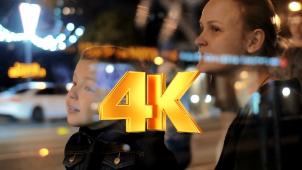 Son And Mother In The City Street alt