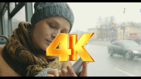 Woman Texting On Cell Phone During Bus Ride alt