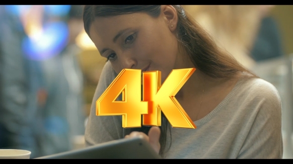 Woman Busy With Phone Talk And Using Pad In Cafe alt