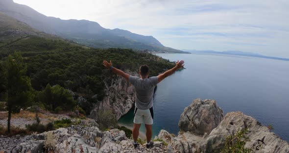 Male Hiker Who Reached Mountain Top Above Adriatic Sea in Dalmatia on Background Rocky mountains