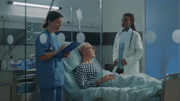 Patient with Disease in Hospital Ward Getting Treatment