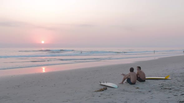 Sitting on beach at sunset