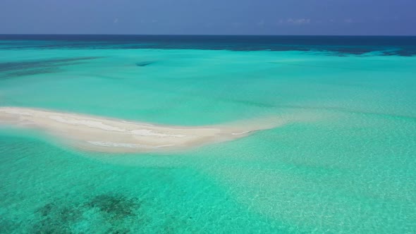 Natural above clean view of a summer white paradise sand beach and aqua turquoise water background 