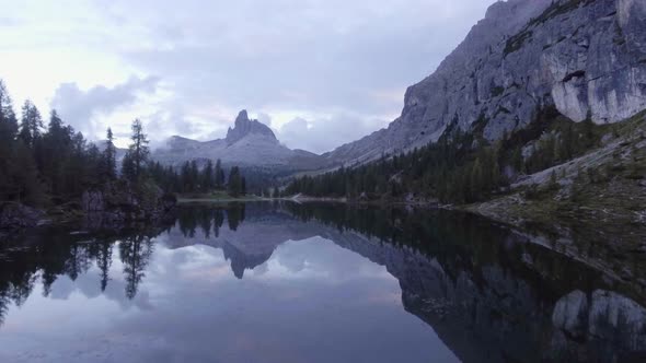 Aerial Drone Flight Establisher Over Lake with Evening Clouds and Forest