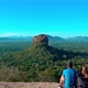 The couple looking in to Sigiriya rock beautiful views at Pidurangala mountain. - VideoHive Item for Sale