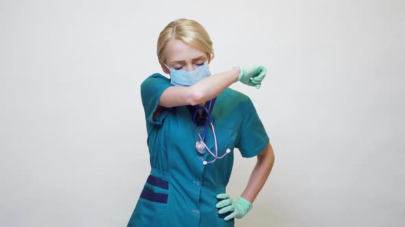 Medical Doctor Nurse Woman Wearing Protective Mask and Rubber or Latex Gloves - Cough