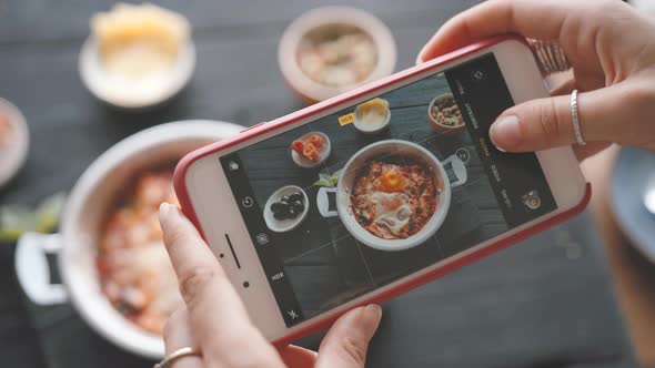 Female Hands Take Photos of Food By Modern Smartphone