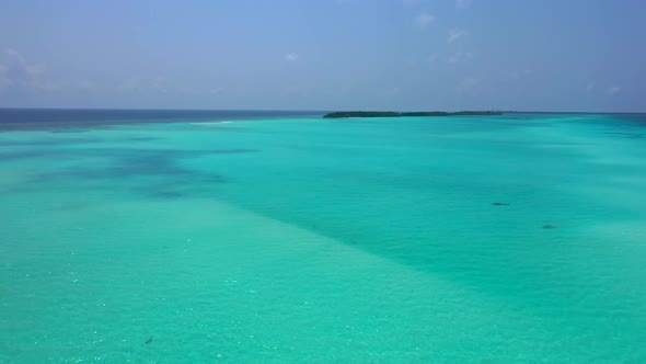 Aerial top down seascape of luxury tourist beach holiday by transparent water and white sand backgro