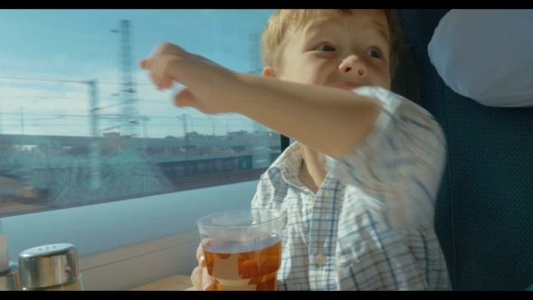 Little Boy Traveling By Train