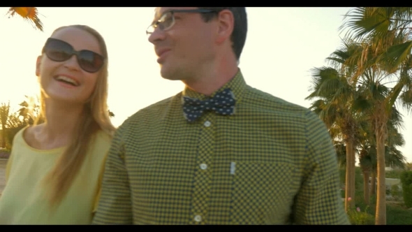 Happy Young Couple Having Enjoyable Walk On alt