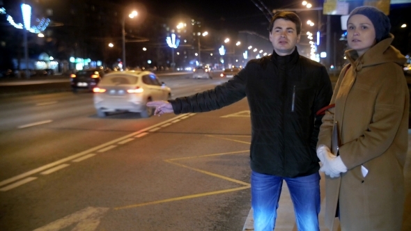 Man And Woman Thumbing On The City Road alt