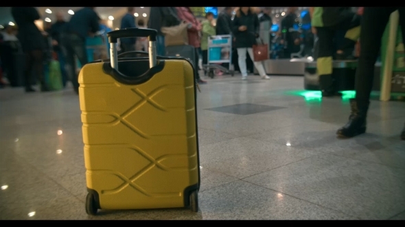Yellow Trolley Bag In Airport Or Railway Station alt