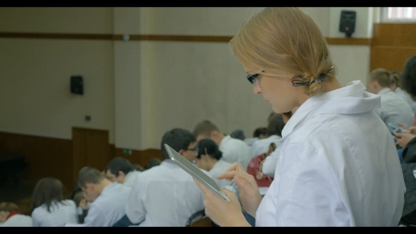 Female Medical Student With Pad On The Lecture alt