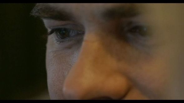 Young Smiling Man With Focus On The Eyes alt