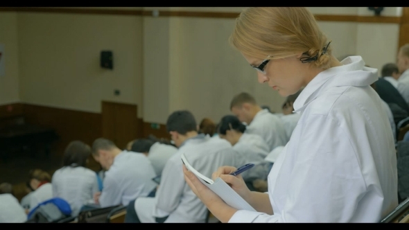 Young Female Doctor On Medical Conference alt