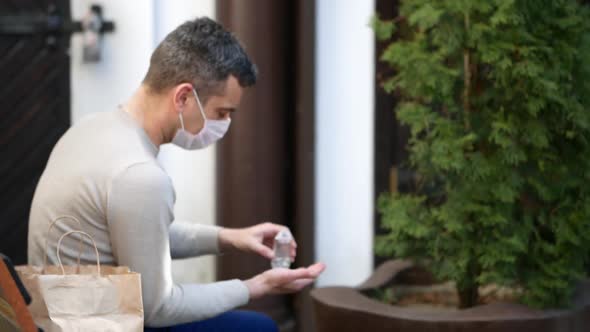 Person is Using Hand Sanitizer to Wash Hands While Outdoor