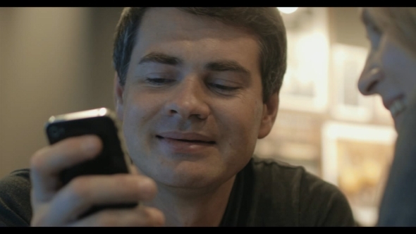 Young People Watching Video On Smart Phone alt