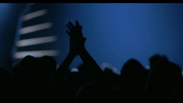 Woman Applauding Among The Crowd alt