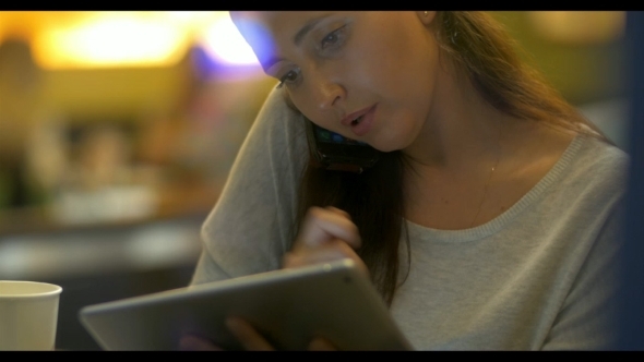 Woman Planning The Evening Using Gadgets alt