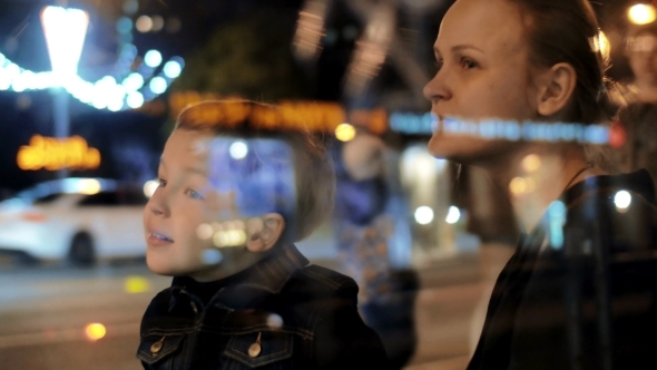 Son And Mother In The City Street alt